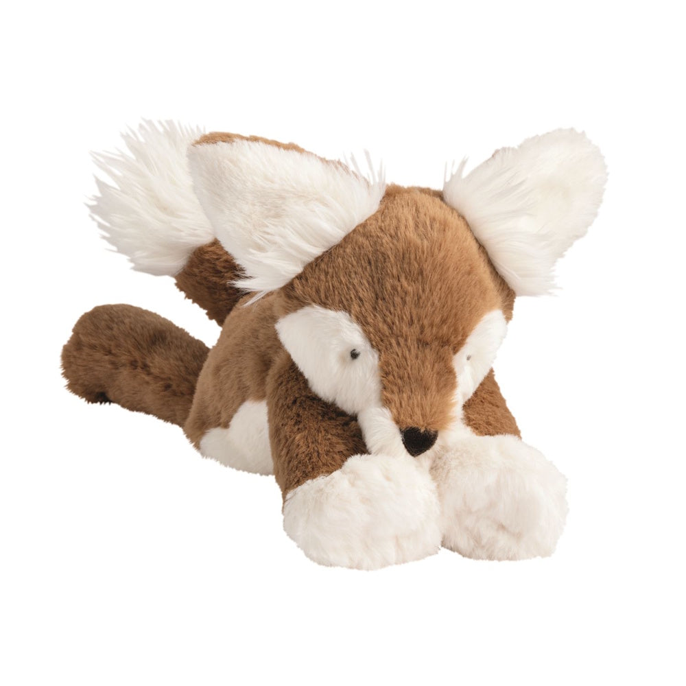 Plush brown and white fox toy lying down with fluffy white ears, paws, and a bushy tail tip.