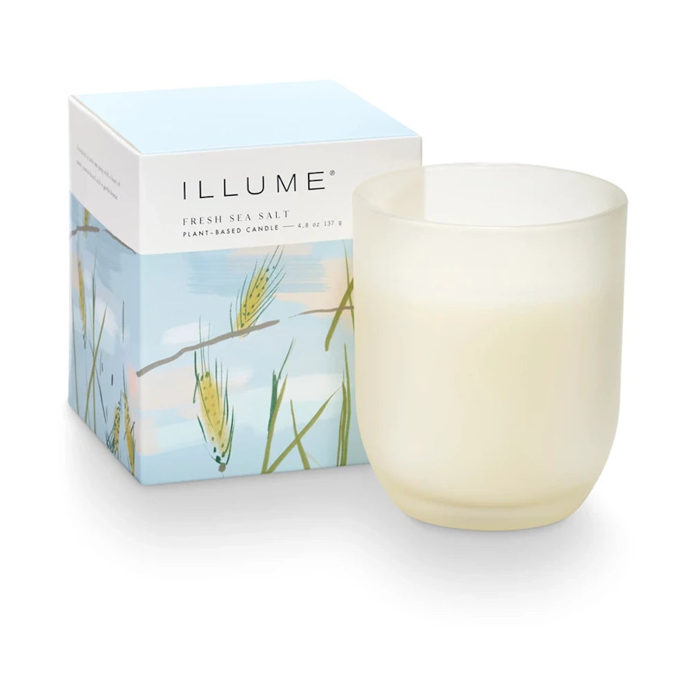 Illume Fresh Sea Salt plant-based candle in a frosted glass jar with a blue and white botanical patterned box.