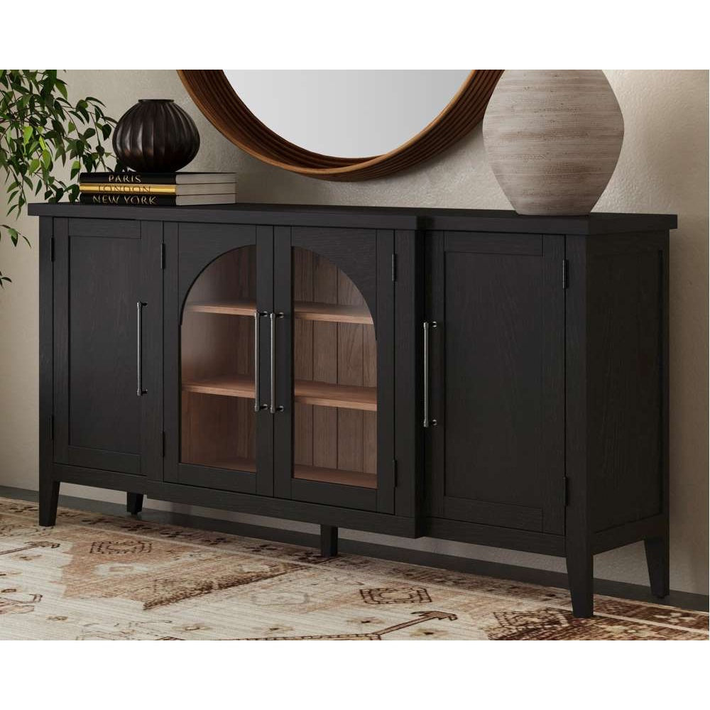 Dark wood sideboard with arched glass doors, silver handles, and wooden shelves on a patterned rug.