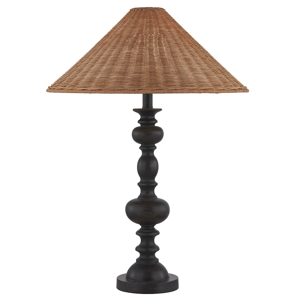 Rustic table lamp with a dark bronze turned wood base and a conical woven rattan lampshade on a white background.