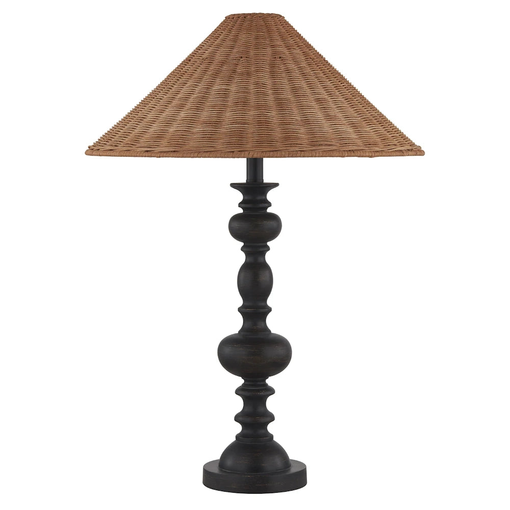 Rustic table lamp with a dark bronze turned wood base and a conical woven rattan lampshade on a white background.