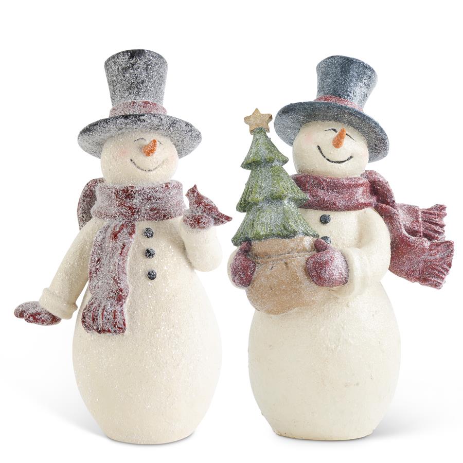 Two vintage glittered snowmen figurines in top hats and red scarves, one holding a cardinal and one a tree.