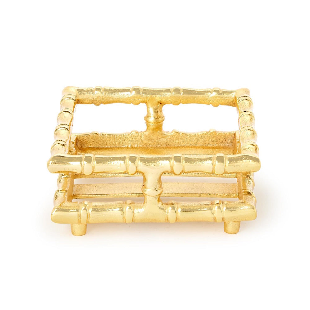 Gold bamboo-style cocktail napkin holder tray centered on a plain white background.