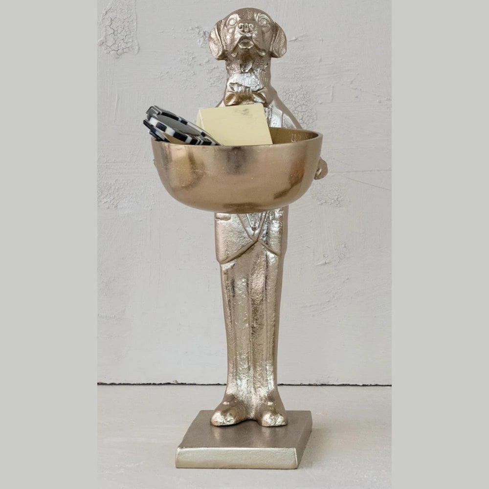 Gold dog butler statue holding a bowl for keys and decor, standing on a white background.