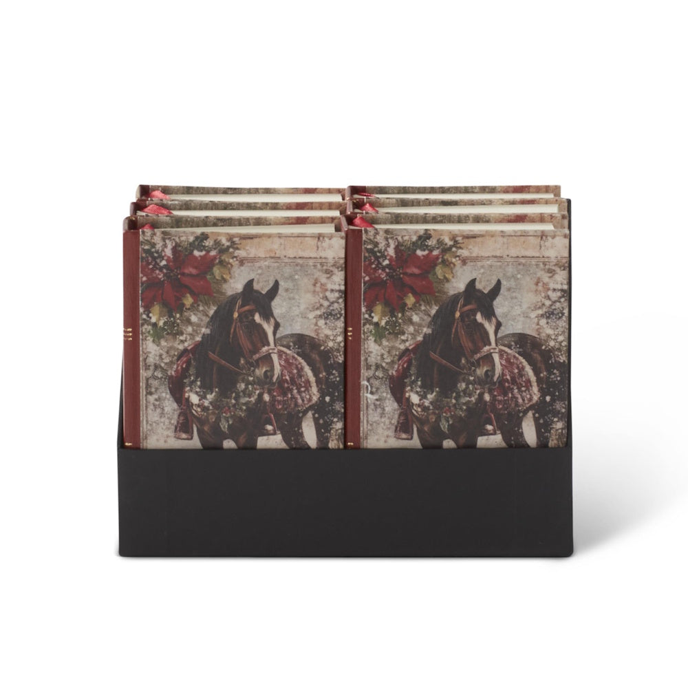 Front view of a display holder filled with equestrian Christmas journals.
