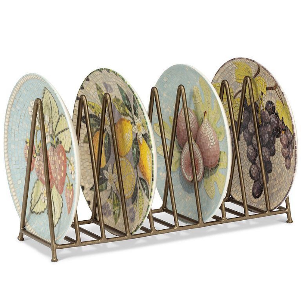 Gold metal wire plate rack holding four decorative mosaic fruit plates.
