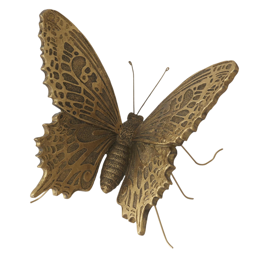 Detailed gold butterfly figurine with intricate wing patterns and thin wire legs on a white background.