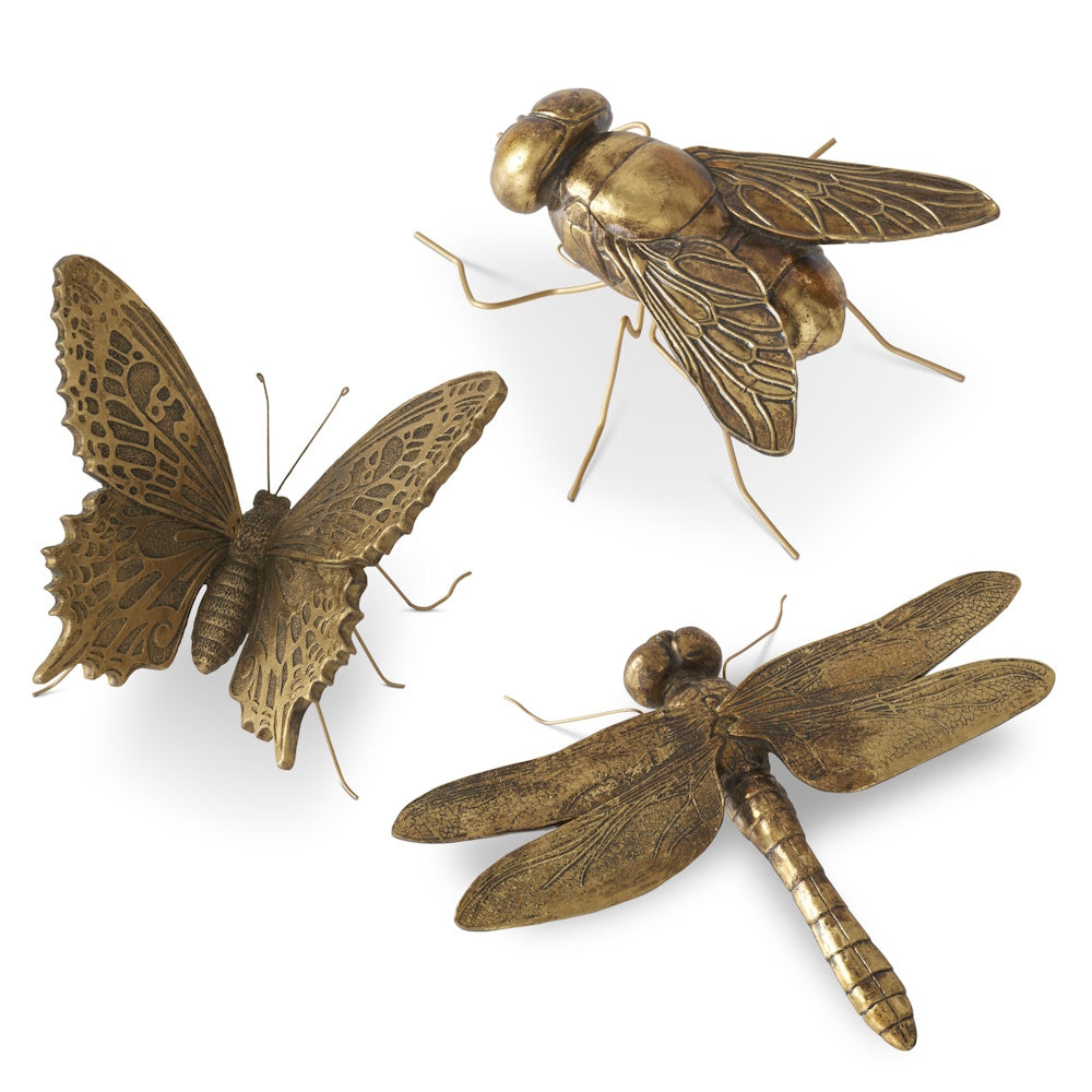 Gold resin insect decor featuring a butterfly, dragonfly, and fly with metal legs on a plain white background.