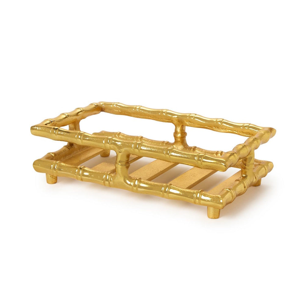 Gold bamboo-style guest towel or napkin holder tray on a white background.