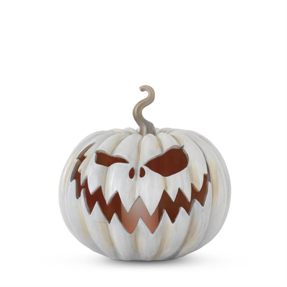 A carved white pumpkin decoration with a spooky, jagged grin and a curled stem on a plain white background.