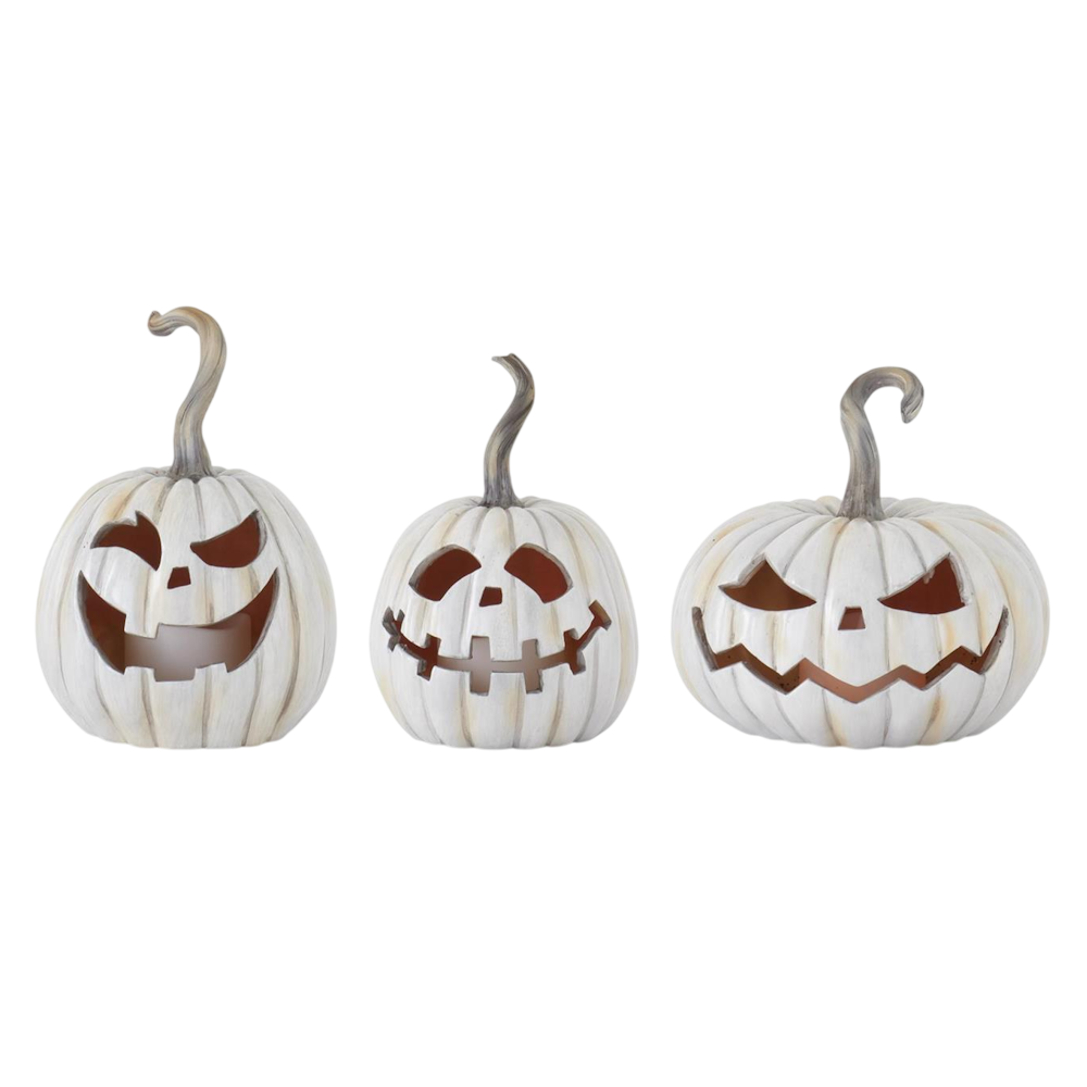 Three white resin LED jack-o'-lantern Halloween decorations with carved spooky faces.