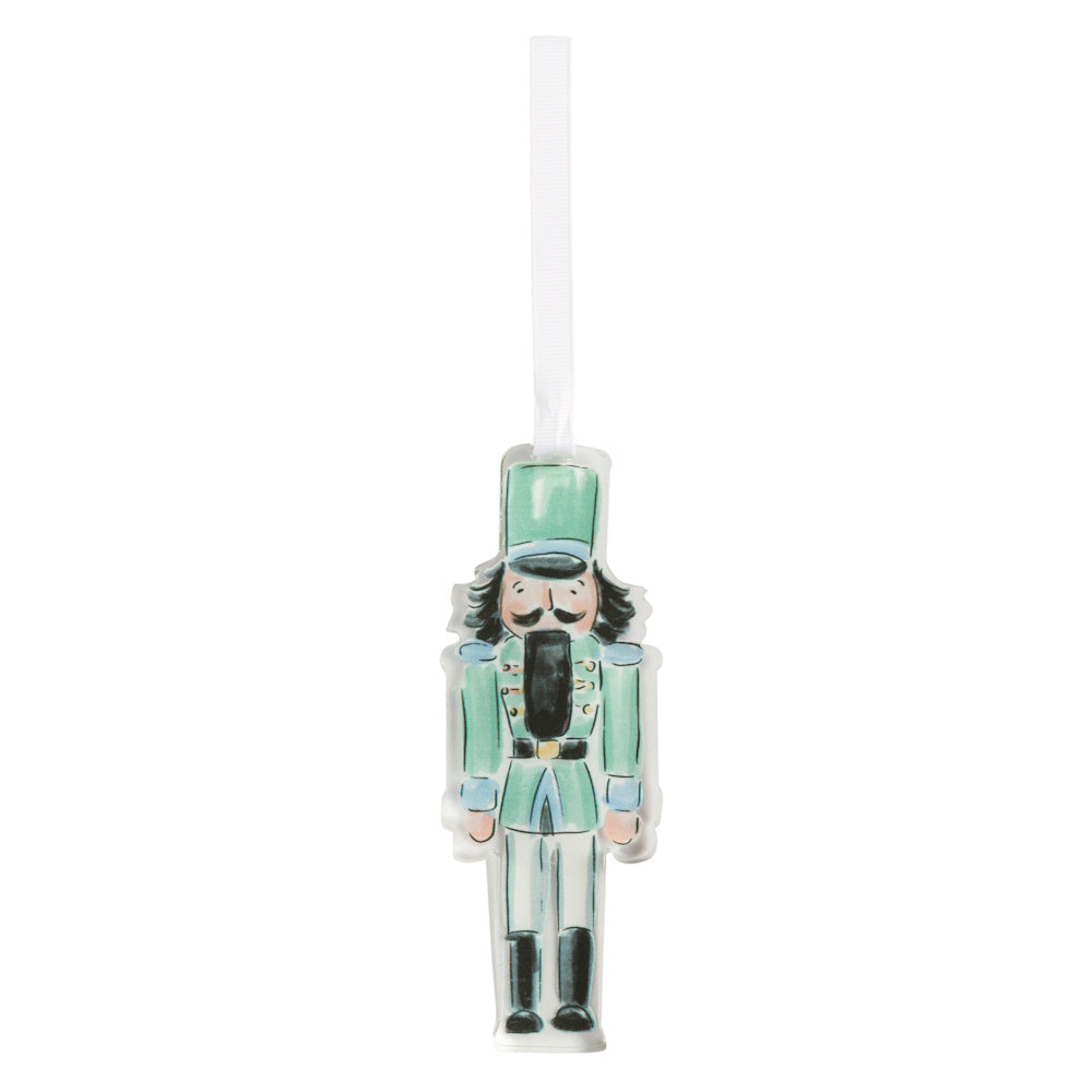 Green acrylic nutcracker ornament with a hanging ribbon.