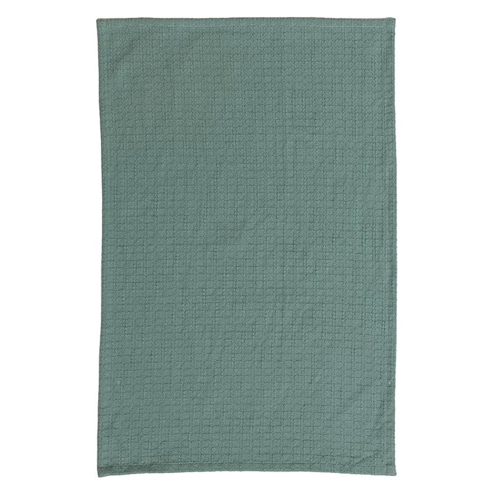 Sage green cotton waffle weave tea towel showing a textured honeycomb pattern for absorbent kitchen use.