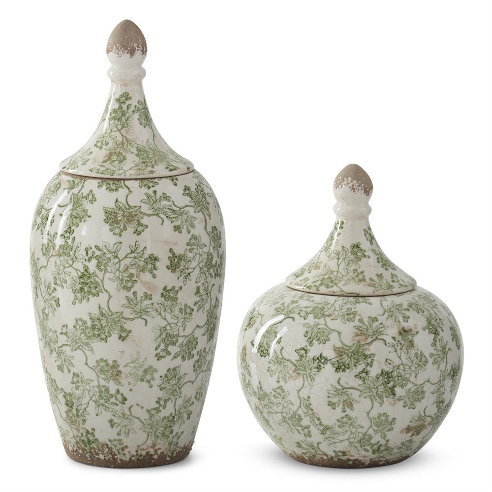 Green and cream crackled ceramic Chinoiserie ginger jars with floral vine patterns and pointed lids on a white background.
