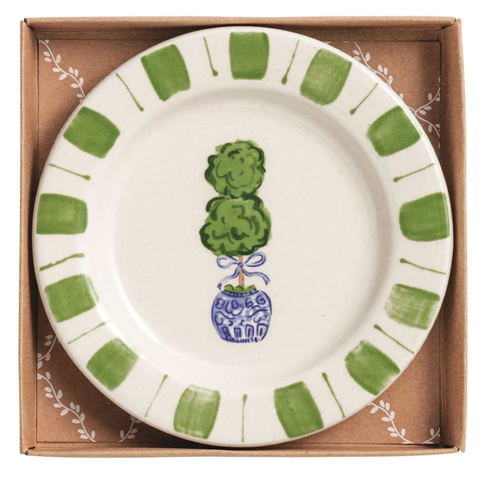 Boxed ceramic tidbit plate with a green topiary in a blue chinoiserie pot and a striped green border.