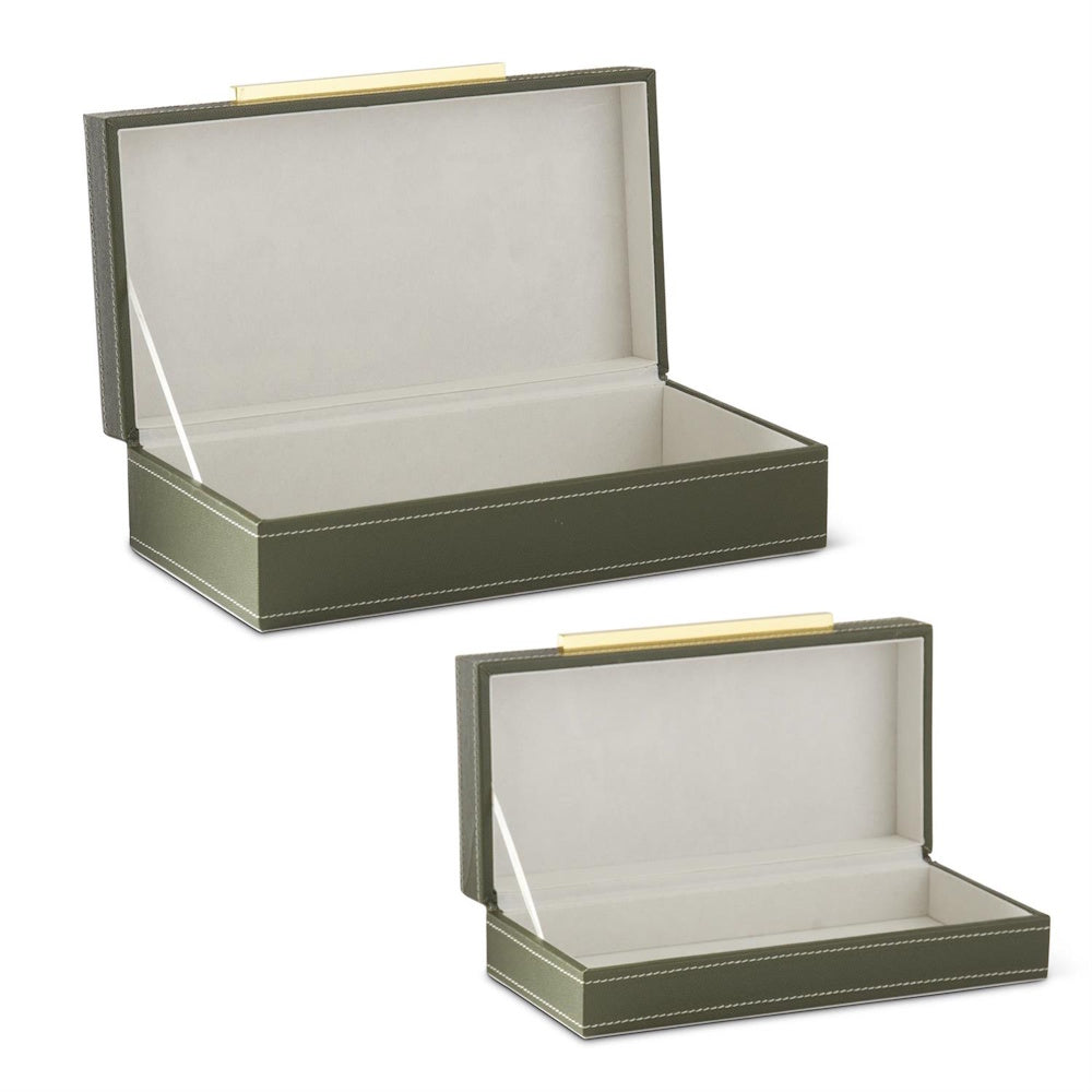 Green vegan leather nesting boxes with felt lining and gold hardware.