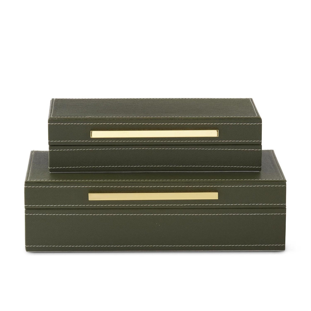 Two green vegan leather nesting boxes with gold hardware and white stitching.