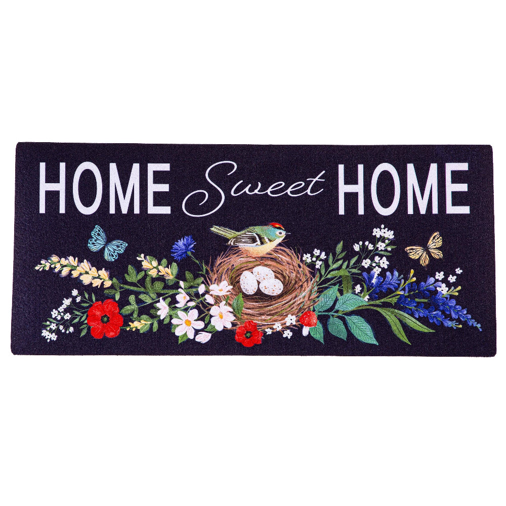Home Sweet Home doormat featuring a bird nest with eggs, colorful flowers, and butterflies on a dark background.