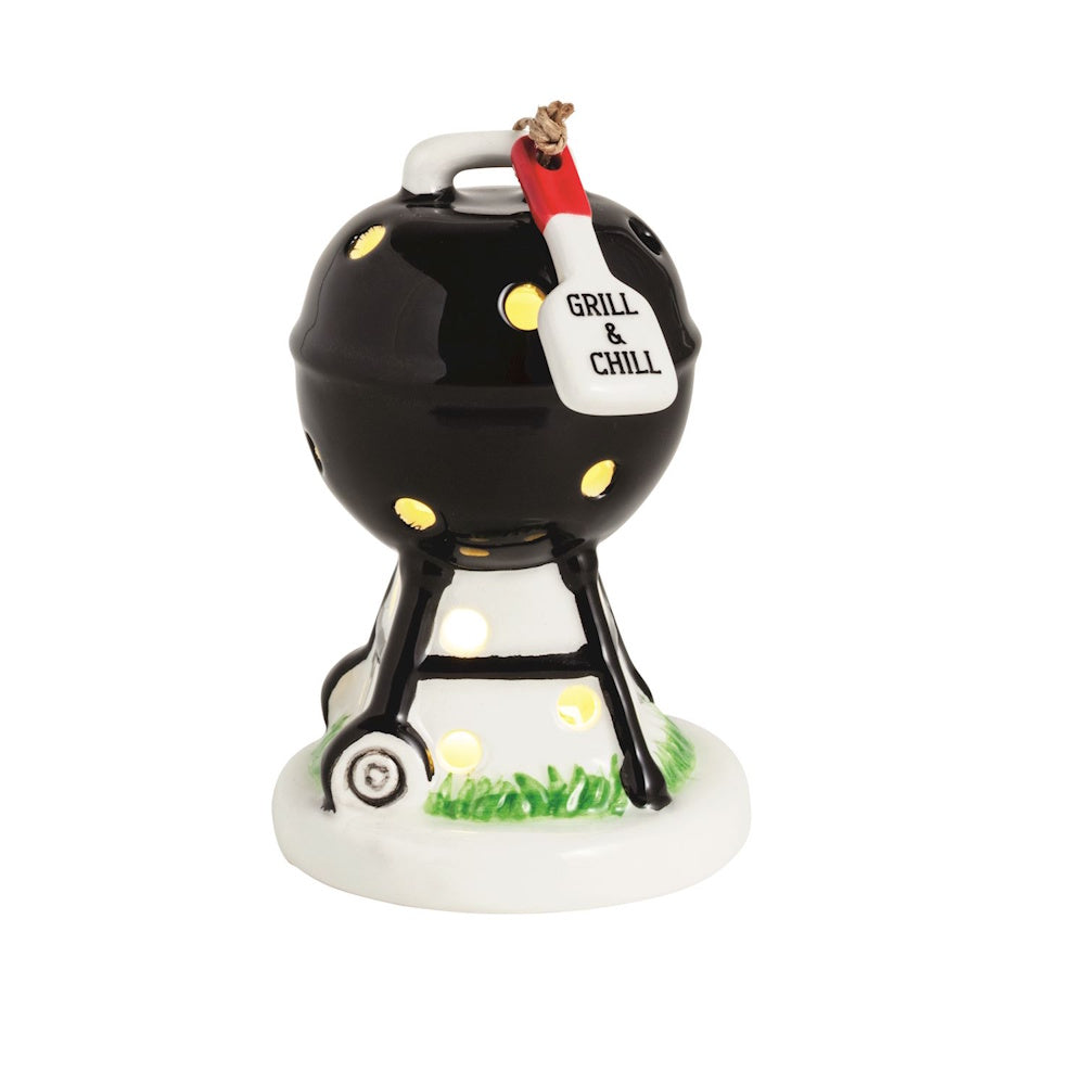 Ceramic light-up charcoal grill sitter with "Grill & Chill" spatula tag, glowing through circular cutouts.