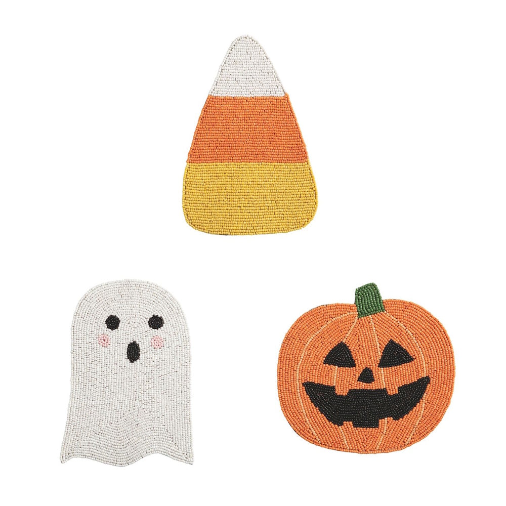 Set of three beaded Halloween trivets shaped like a candy corn, ghost, and jack-o'-lantern.