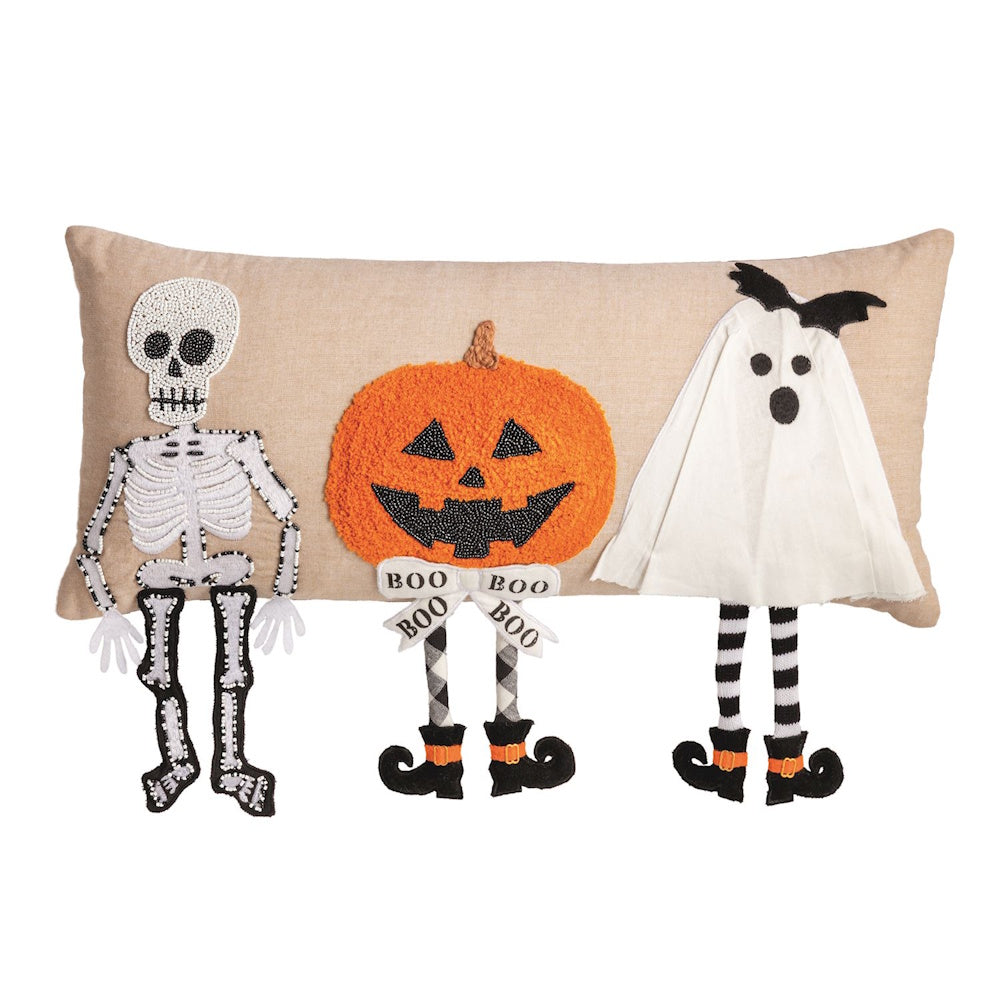 Halloween lumbar pillow featuring a skeleton, jack-o'-lantern, and ghost with dangling legs.