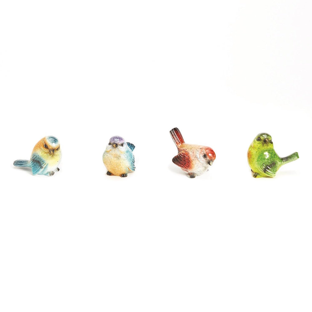 Set of four small hand-painted bird figurines in various colors lined up on a plain white background.