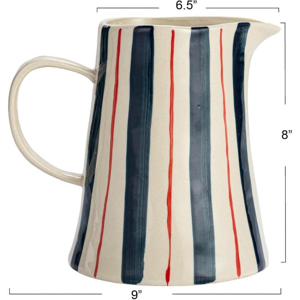 Hand-painted ceramic pitcher with blue and red vertical stripes, showing dimensions of 6.5 by 8 by 9 inches.