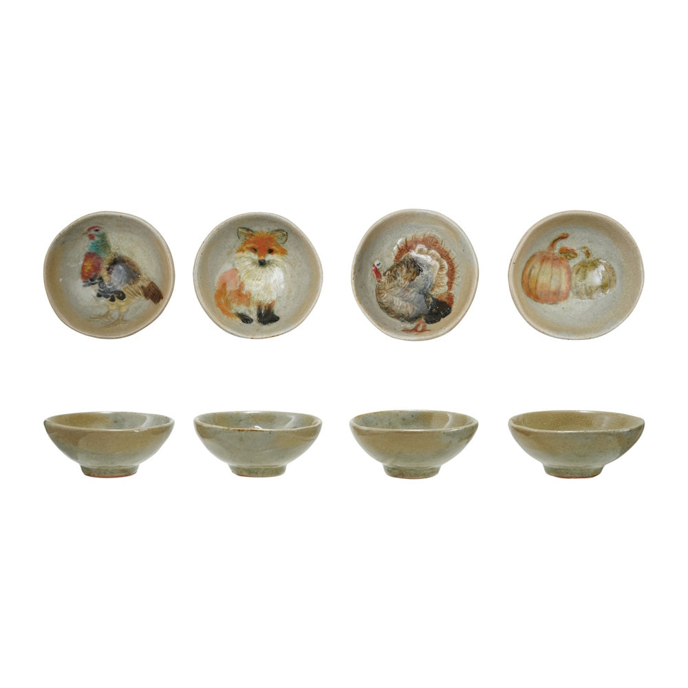 Set of four small stoneware dishes with hand-painted autumn designs: pheasant, fox, turkey, and pumpkins.