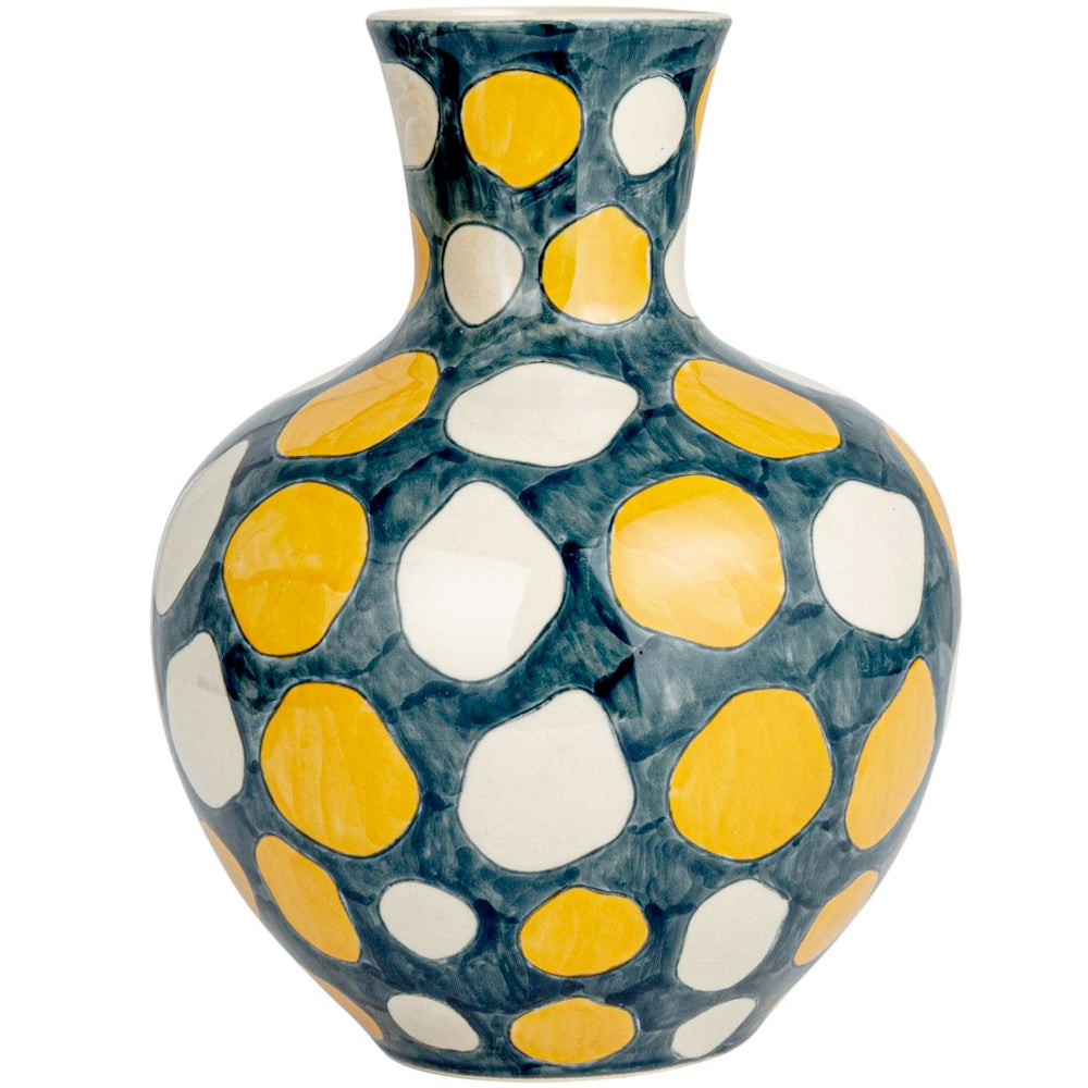 Hand-painted ceramic vase with yellow and white polka dots on a blue-grey background on white background.
