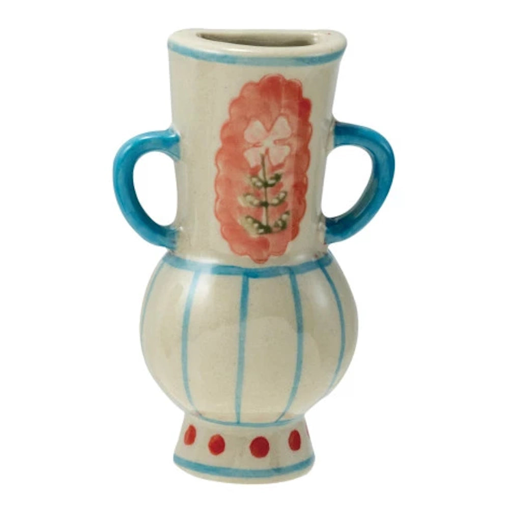 A ceramic vase features a red floral design and blue stripes against an off-white glaze with a simple background.