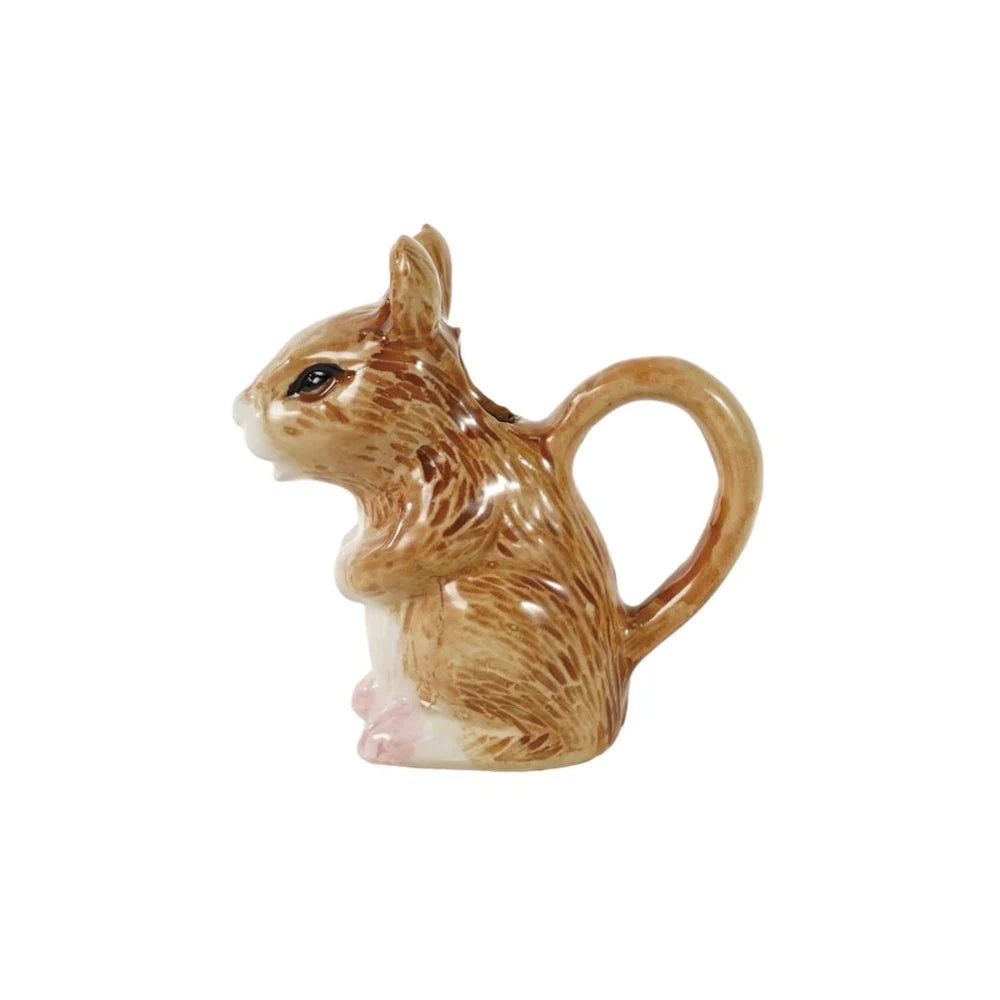 Hand-painted brown stoneware mouse-shaped creamer with a looped handle.