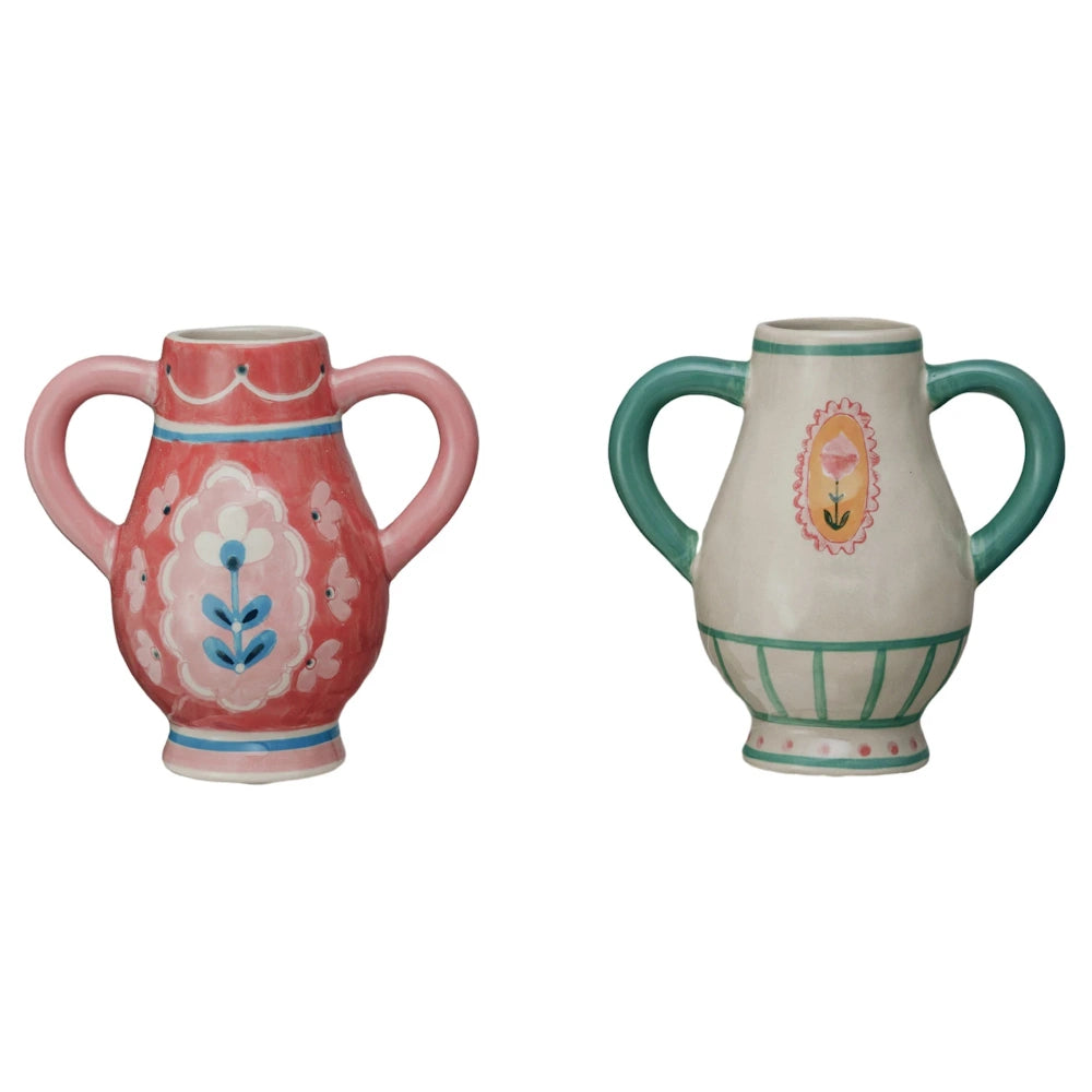 Two hand-painted stoneware urn vases with flower handles in pink and cream, featuring decorative floral patterns.