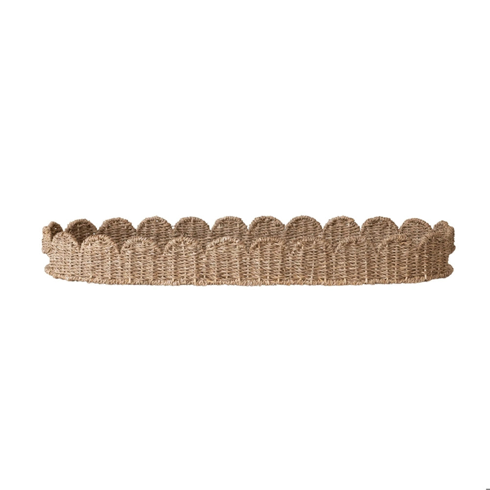 Oval hand-woven bankuan grass tray with scalloped edges and side handles on a plain white background.