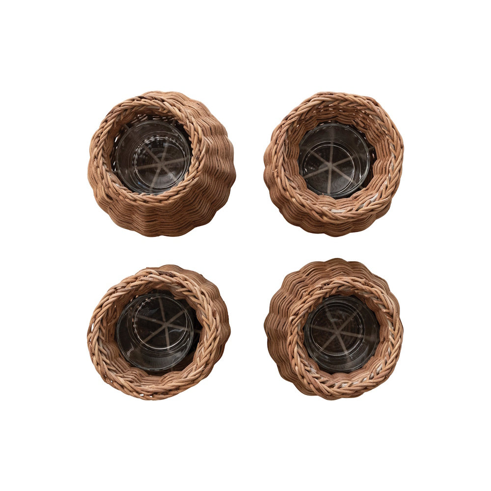 Top view of four natural woven rattan vases showing clear glass insert cups inside.