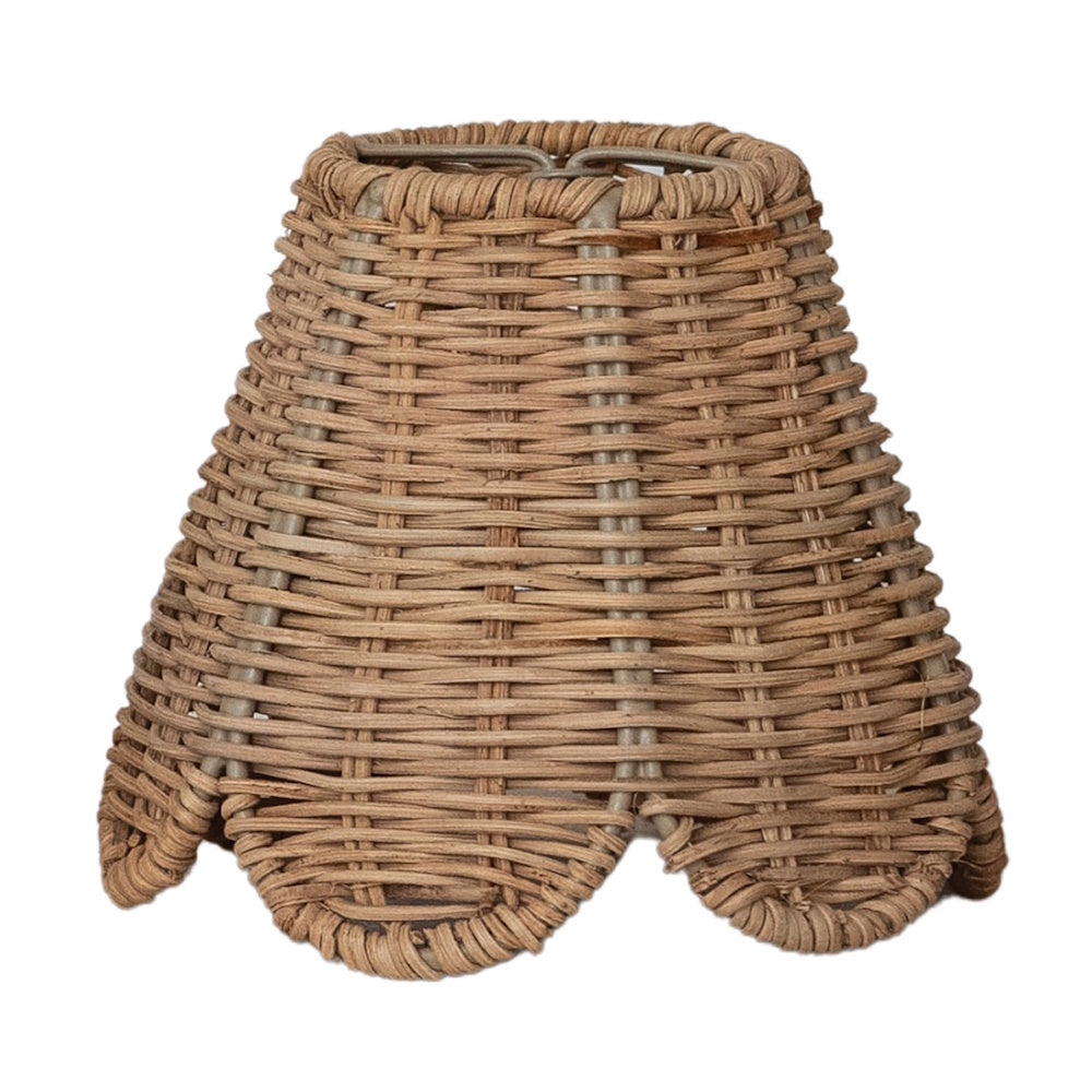 Hand-woven seagrass mini lamp shade featuring a tapered shape and a scalloped bottom edge against white.