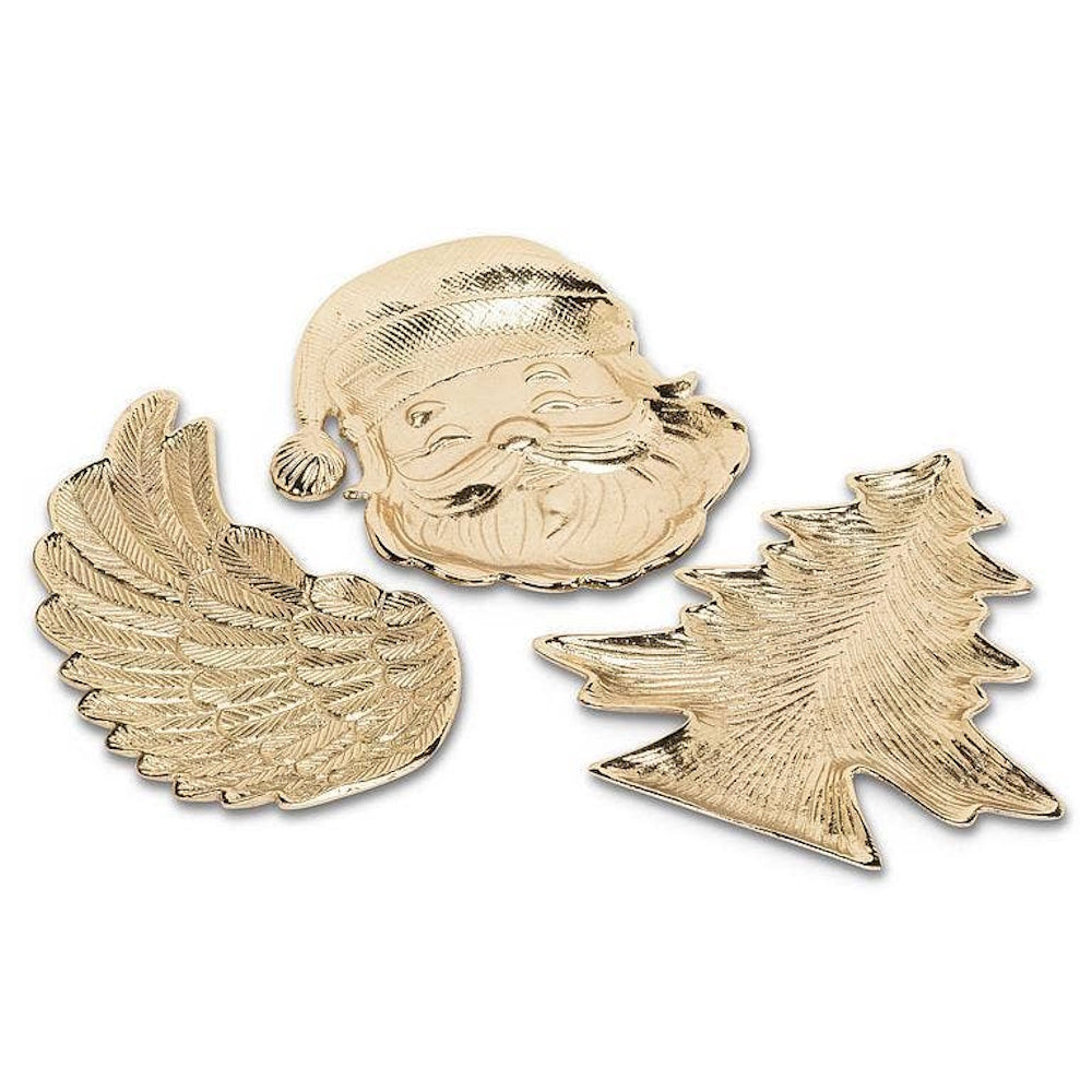 Three gold metallic decorative dishes shaped like an angel wing, Santa head, and Christmas tree.