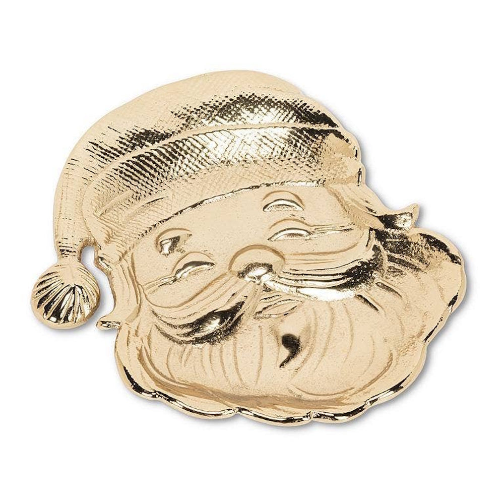 Gold metallic trinket dish shaped like a smiling Santa Claus head wearing a hat on white background.