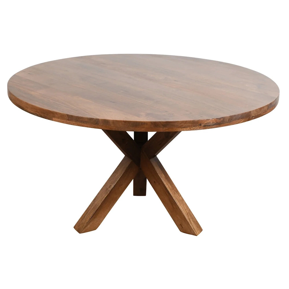 Round natural wood dining table with thick tabletop and X shaped pedestal base for rustic dining rooms.