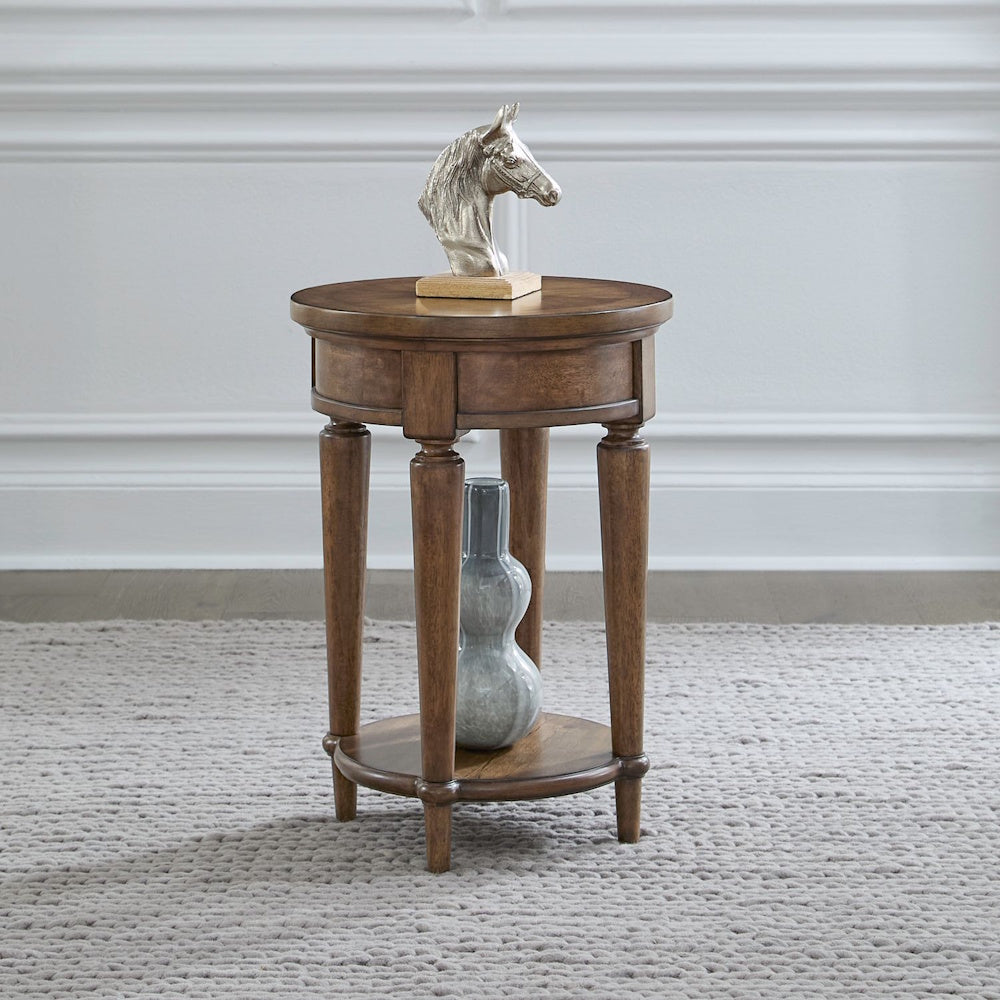Harrison Heights round wooden chairside table with a horse head statue and a grey vase on a textured rug.