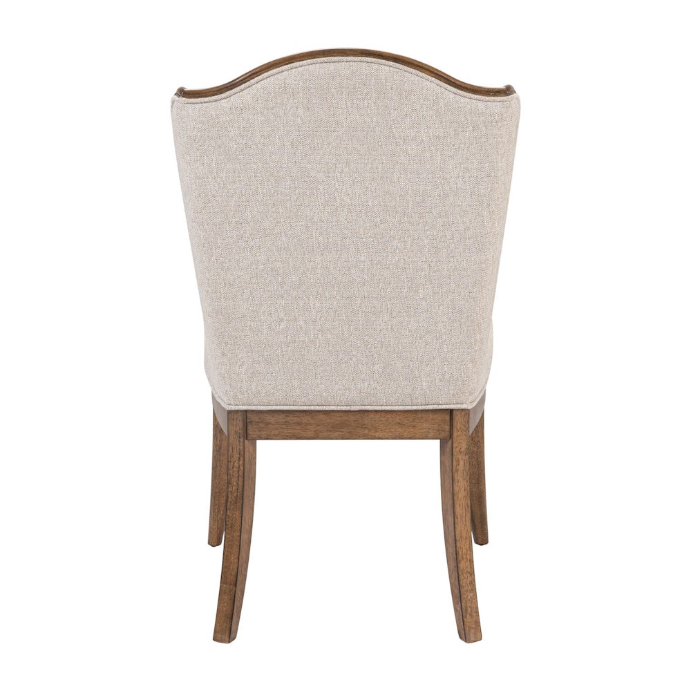 Rear view of a Harrison Heights upholstered side chair featuring tan textured fabric and a dark wood frame and legs.