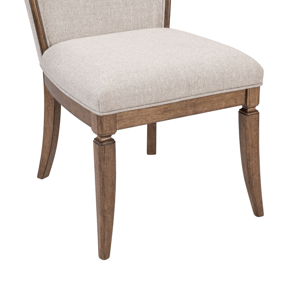 Upholstered dining chair featuring a light beige fabric seat and dark wood frame with elegant turned legs.