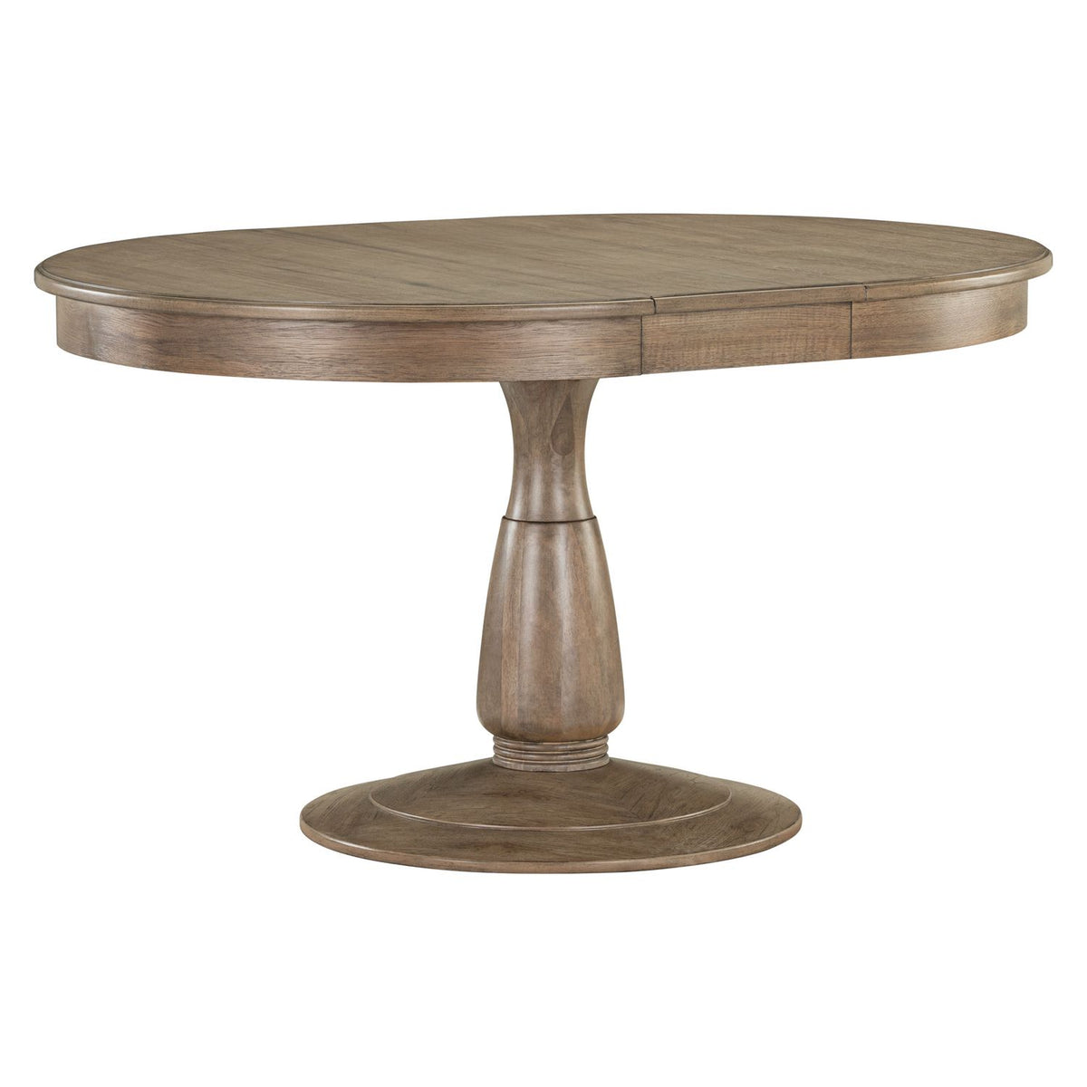 Round pedestal dining table in a warm wood finish, extended into an oval shape with a leaf insert.