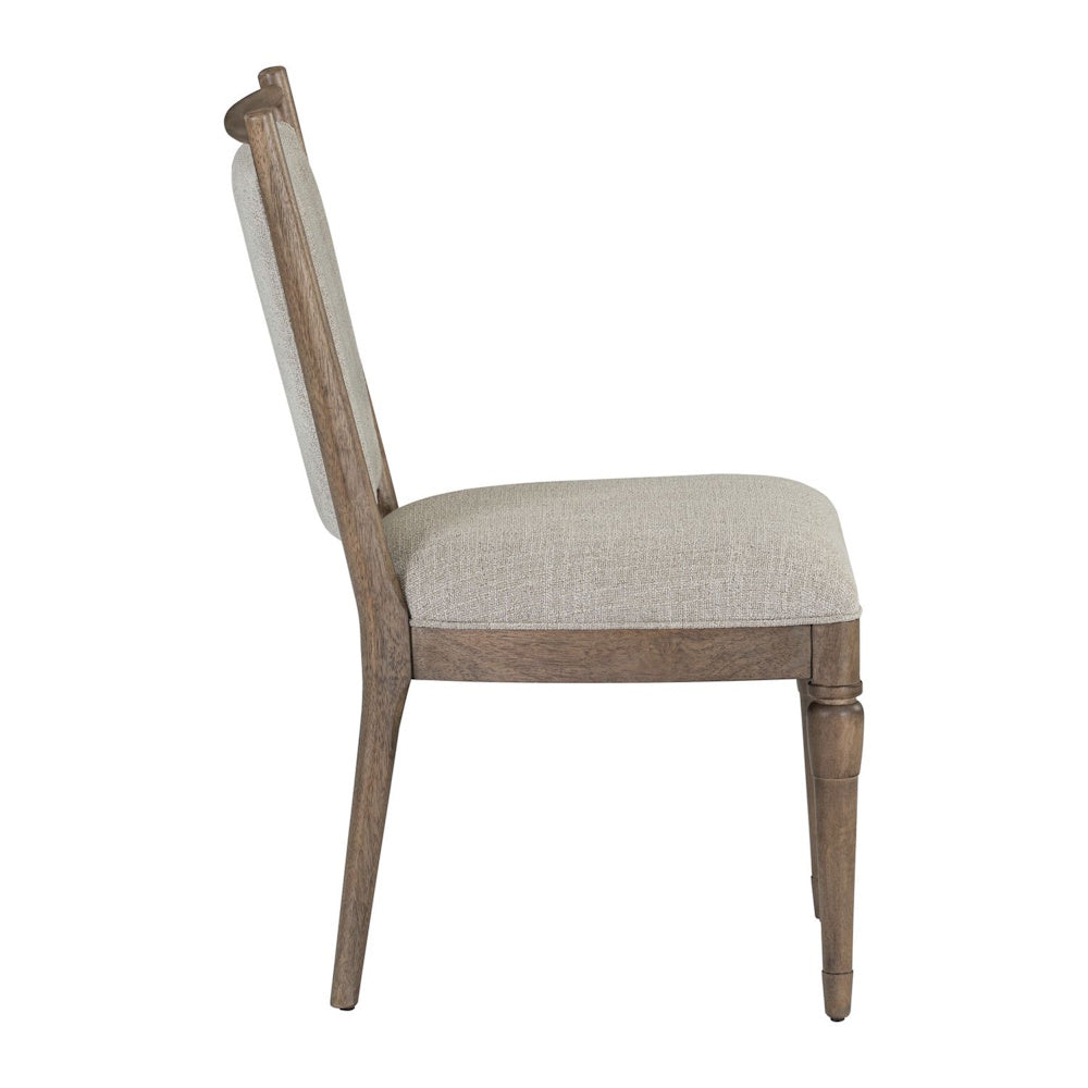 Side profile of Hickory Grove upholstered dining chair with a wooden frame and light beige fabric cushion.