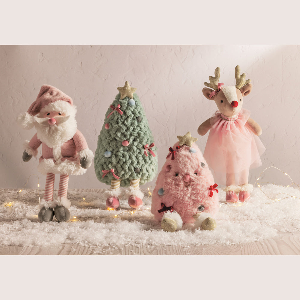 Plush holiday decor featuring Santa, a reindeer in a pink tutu, and two textured Christmas trees on a snowy surface.