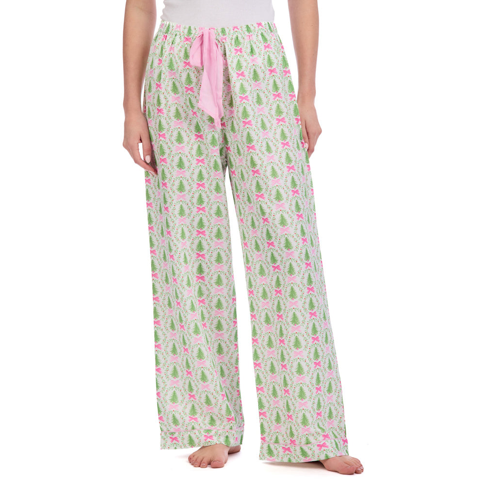 Wide-leg holiday pajama pants with a green Christmas tree and pink bow pattern, featuring a pink drawstring waist.