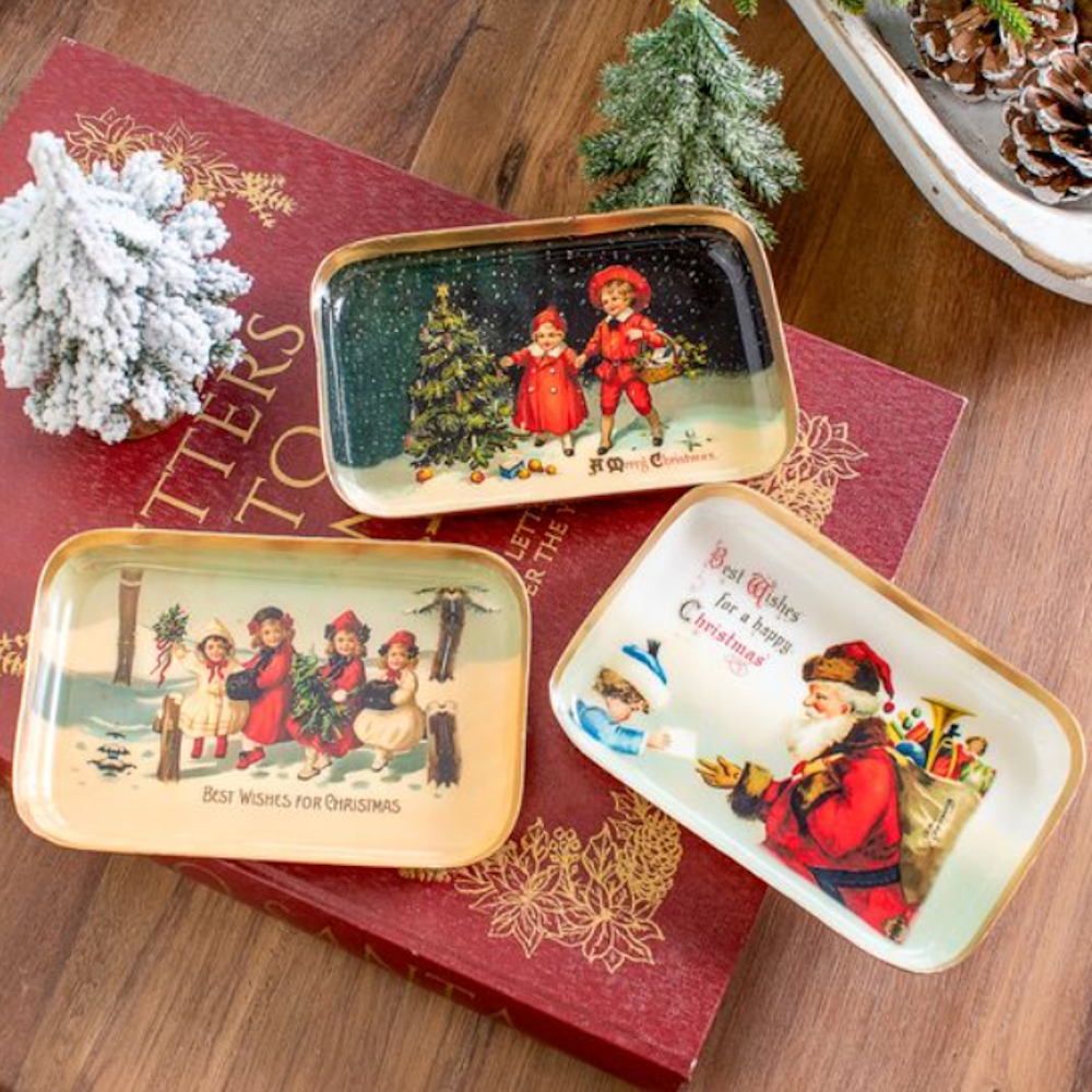 Three vintage mini trinket trays featuring nostalgic Christmas illustrations with gold rims.