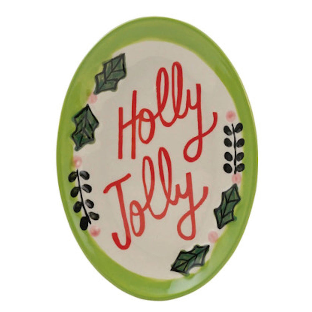 Oval stoneware dish with a green border featuring a holly leaf border and the words "Holly Jolly".