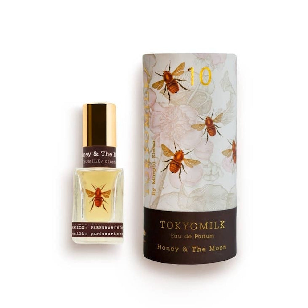 TokyoMilk Honey & The Moon No. 10 perfume bottle alongside its decorated cylindrical packaging with bee motifs.