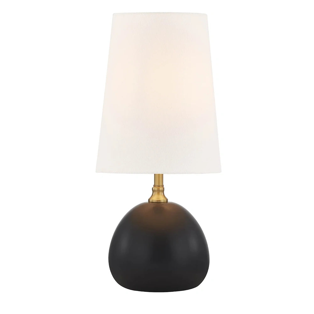 Black dome table lamp with white tapered shade and antique brass accents for modern decor.