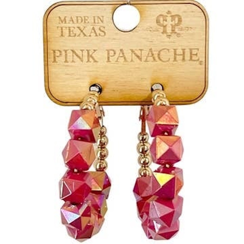 Pink Panache iridescent fuchsia and gold beaded hoop earrings on a wooden display card.